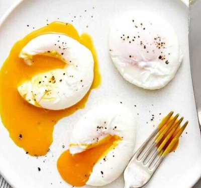 Poached eggs with runny yolk on a plate