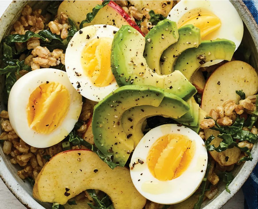 Grain bowl with jammy eggs, avocado, and apple